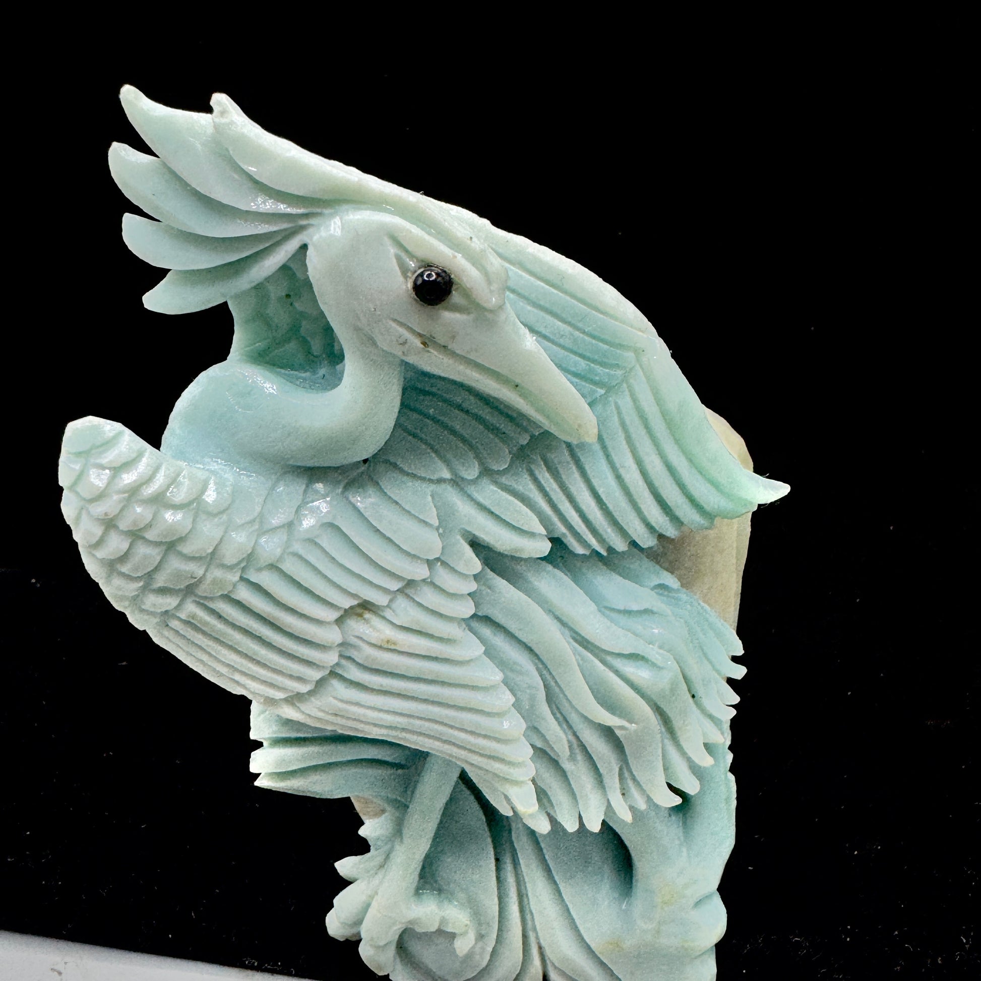 The bird sculpture positioned to symbolize clear and truthful communication