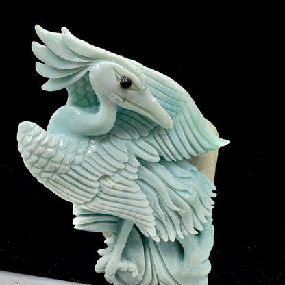 The bird sculpture positioned to symbolize clear and truthful communication