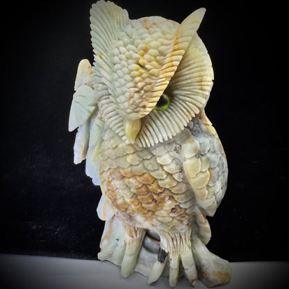  Owl carving glowing in sunlight, showcasing Amazonite’s color variations for positive energy decor.