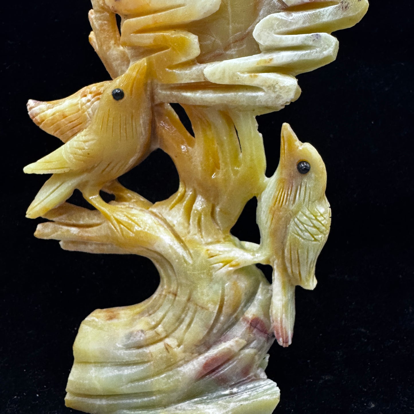 The sculpture used in a Reiki healing session alongside other crystals.