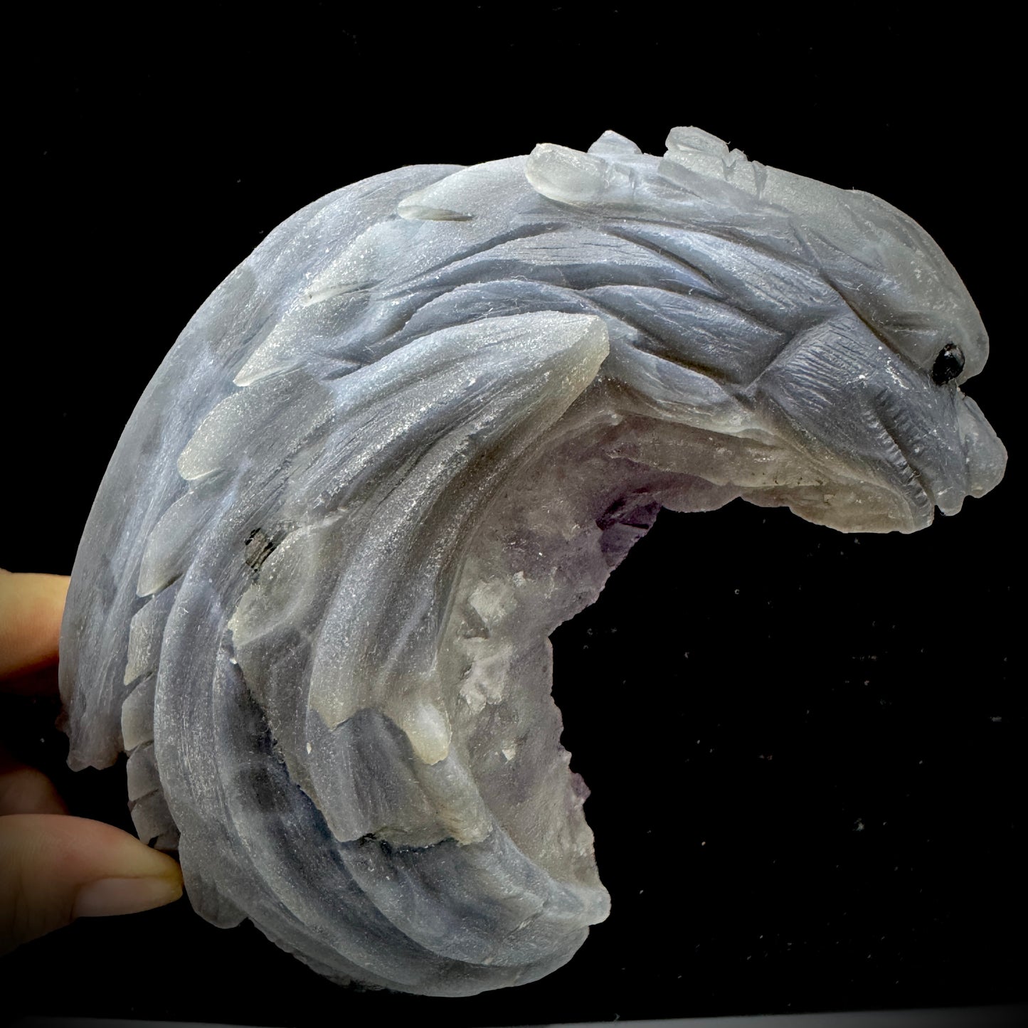 The stone's colors highlighted, representing the balance between higher and lower chakras.