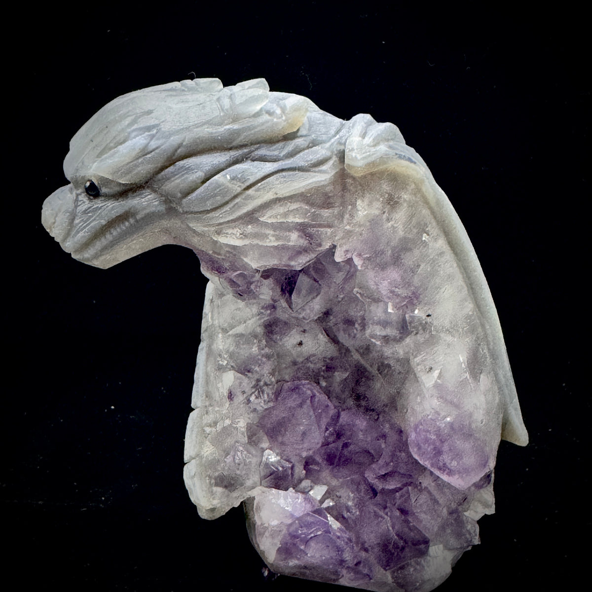 A shot emphasizing the skilled hand-carving that brings the dragon to life from the raw stone.