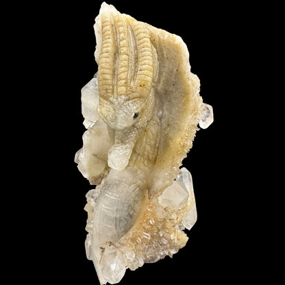 Detailed close-up of the hand-carved dragon design on white quartz
