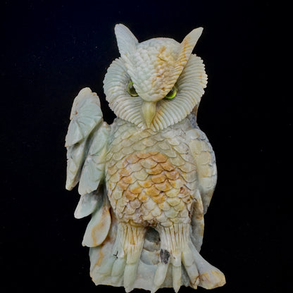 Amazonite owl alongside quartz and amethyst, illustrating its unique place in crystal healing collections.