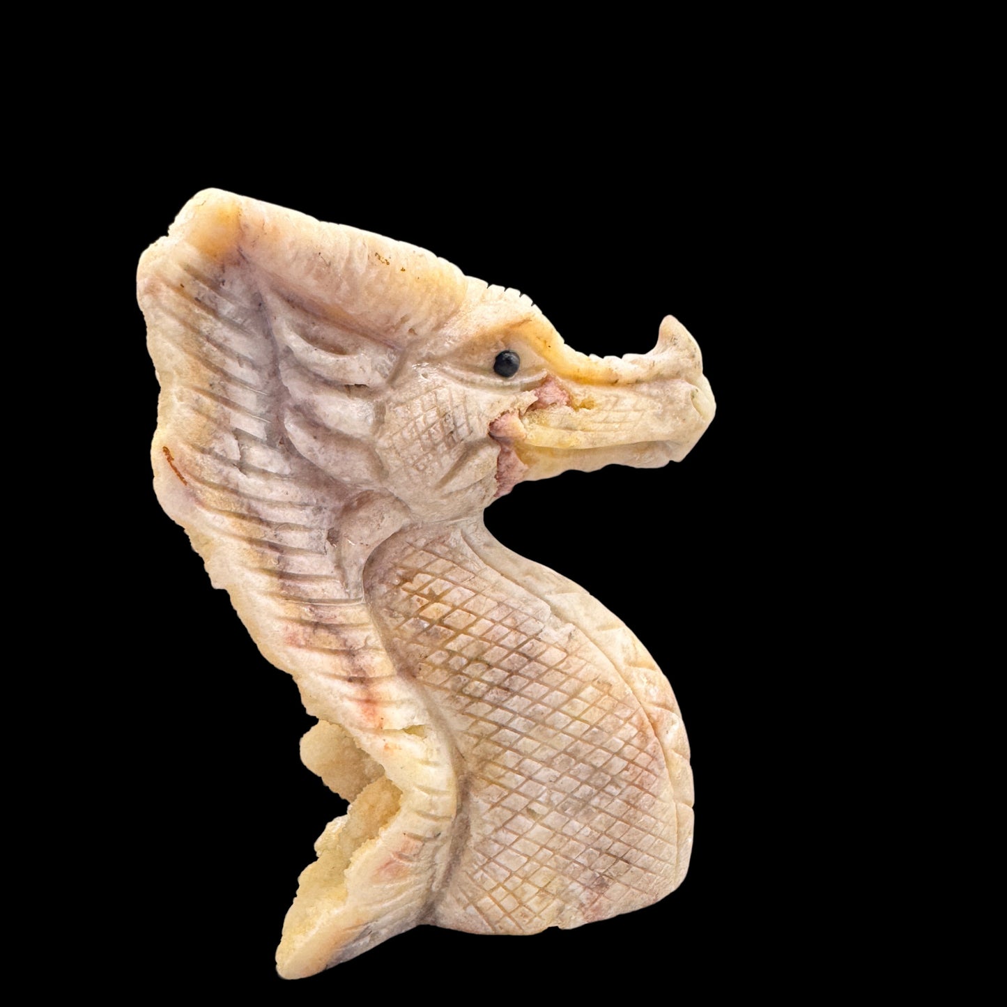  The calcite dragon illuminated by soft light, emphasizing its natural translucency and