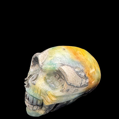 Skull positioned on a wooden altar with crystals.