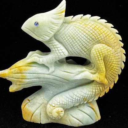 A hand-carved lizard figurine made from natural Amazonite crystal