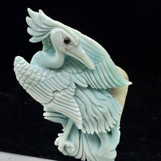 A serene hand-carved bird figure made from natural blue-green Amazonite stone.