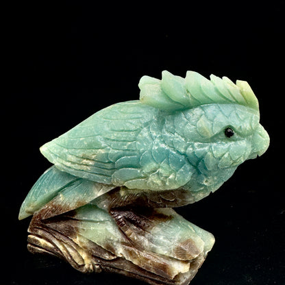 An extreme close-up of the parrot's head, revealing the masterful carving of its beak and eyes, capturing its wise expression.