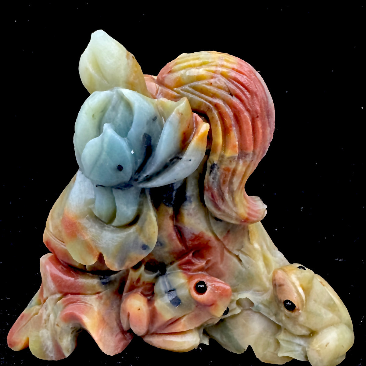 Emphasizing the artisan skill required to carve the Money Frog from solid Amazonite stone.
