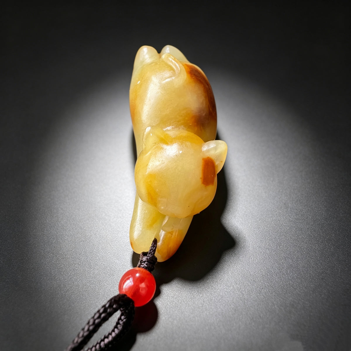 Natural jade carved resting cat pendant front detail