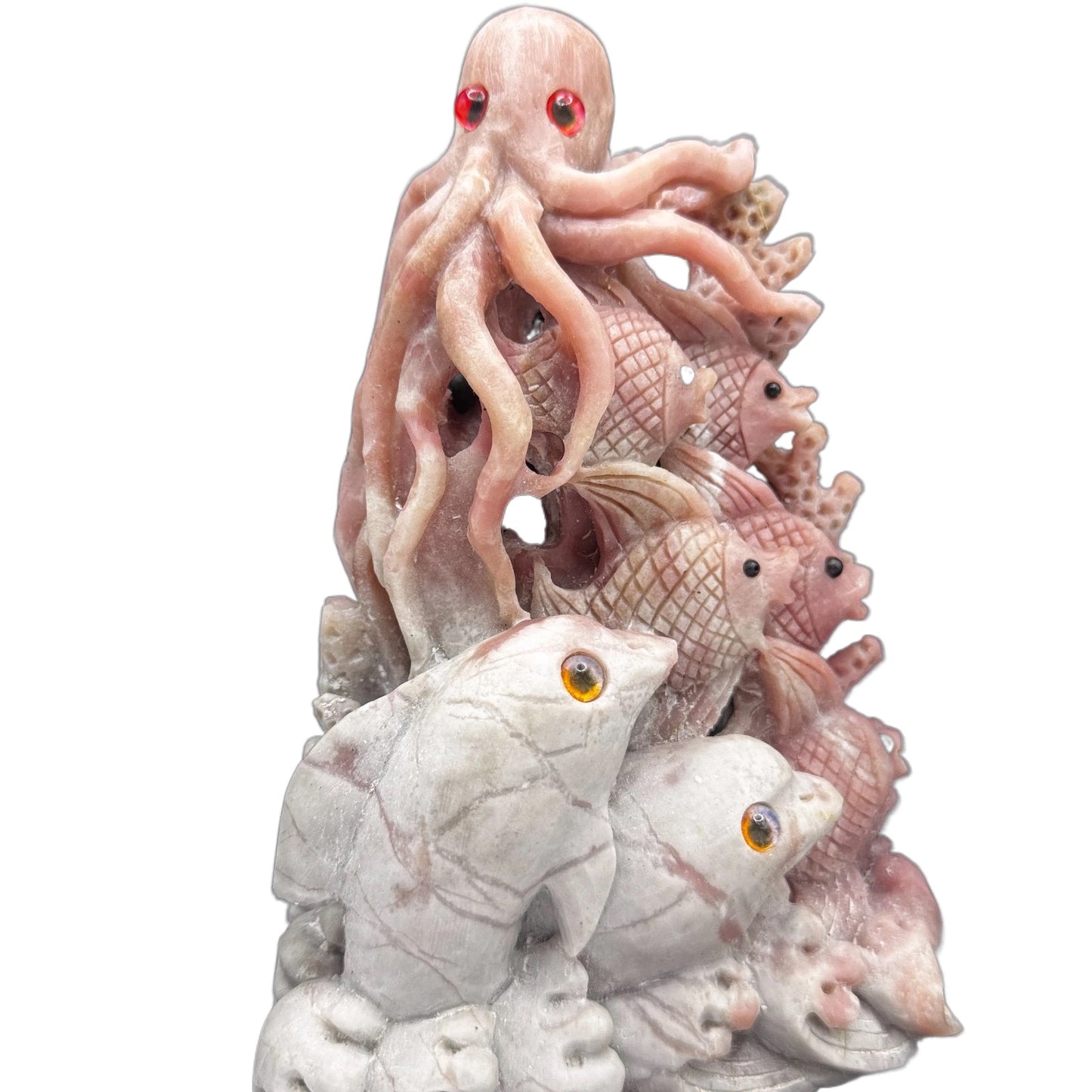 The pink opal sea creature placed on a meditation altar with candles, serving as a tool for intuition and inner peace.