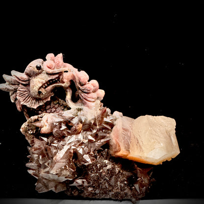  A majestic dragon hand-carved on a genuine red crystal cluster mineral specimen.