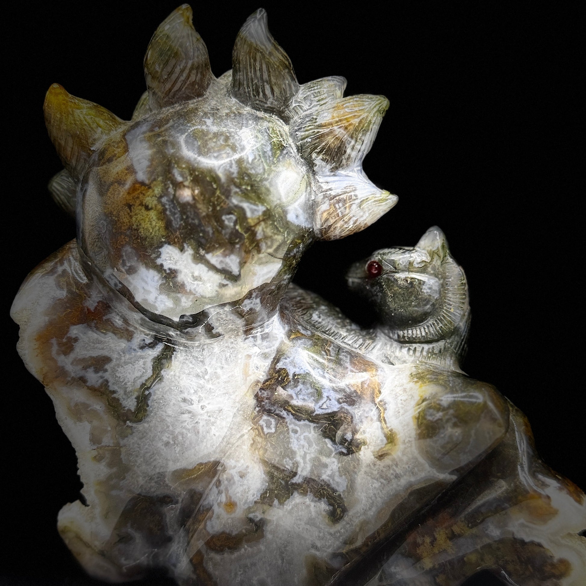 A healer of the navel chakra meditates while holding a spiritual fox.