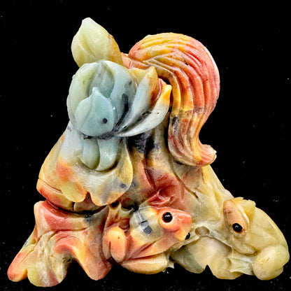 The calming presence of the green Amazonite frog, promoting hopeful and peaceful vibes.