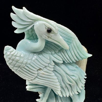 . The smooth, calming appearance of the Amazonite bird, promoting a peaceful vibe.