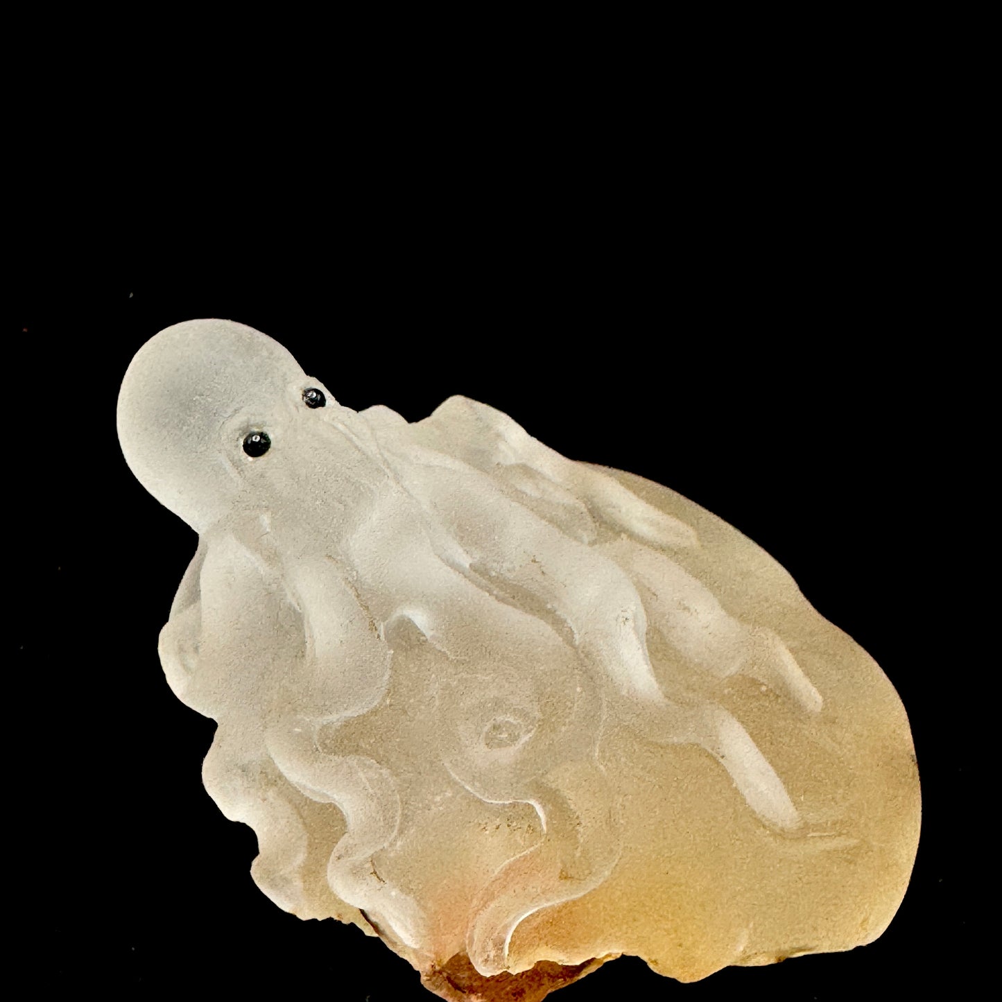 The octopus sculpture glows in sunlight, enhancing its metaphysical properties for energy work.