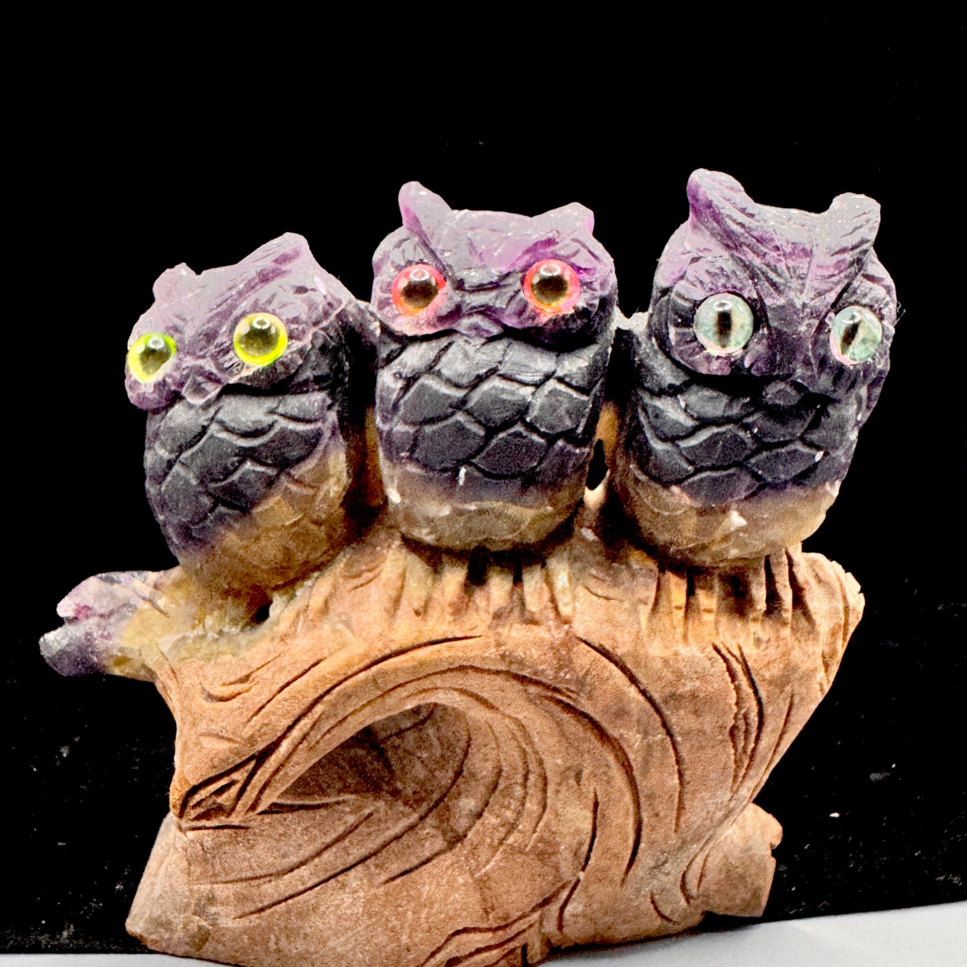 Fluorite owl sculpture on office desk for mental clarity during work