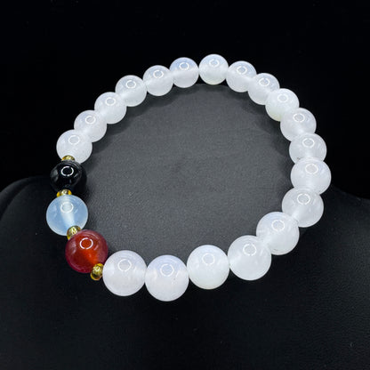 The bracelet is worn on the wrist, symbolizing its rooted energy connected to the earth.