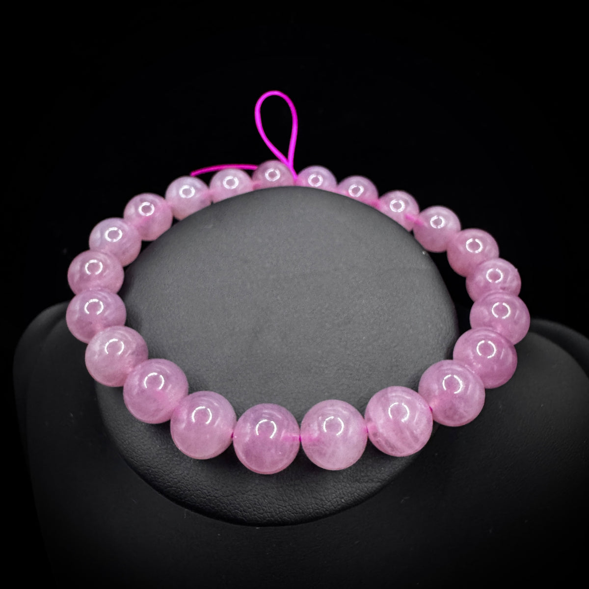 The bracelet is worn on the wrist at the pulse point, symbolizing its connection to the heart chakra energy.