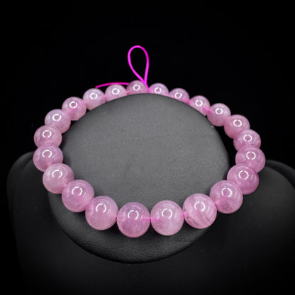 The bracelet is worn on the wrist at the pulse point, symbolizing its connection to the heart chakra energy.