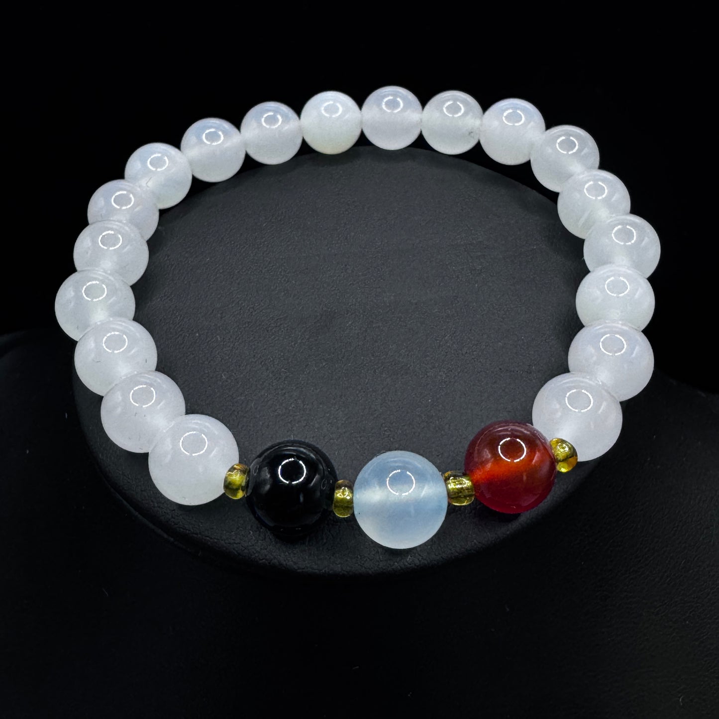 Natural agate bead bracelet laid flat to showcase its unique banded patterns and colors.