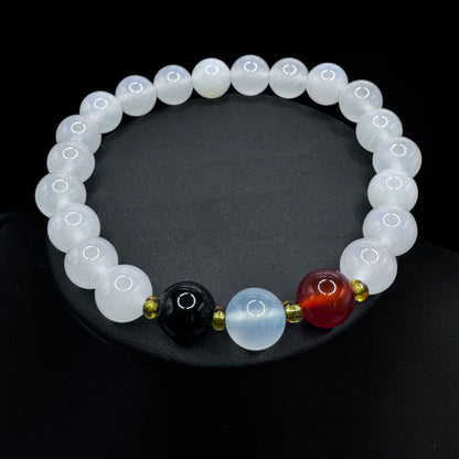 Natural agate bead bracelet laid flat to showcase its unique banded patterns and colors.