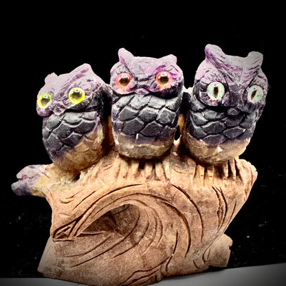 Size comparison showing small medium large fluorite owl arrangement