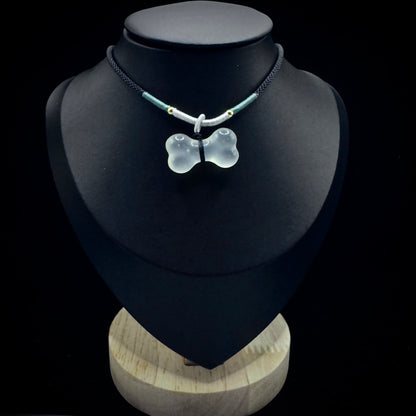 A model wearing a bone choker necklace, showcasing a fashion look that combines style and spirituality.